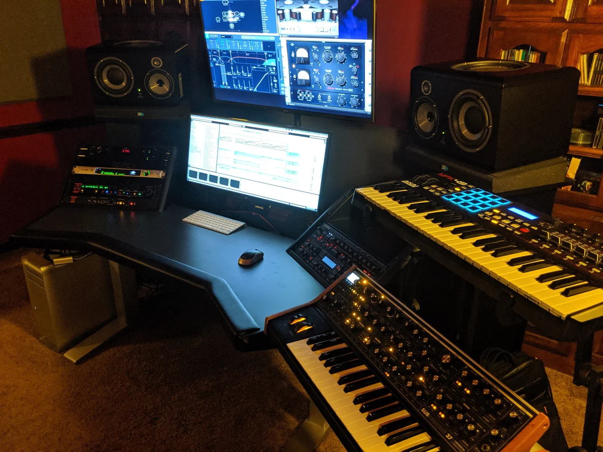 Keyboards and music equipment surrounded by warm wood in TASADI’s studio